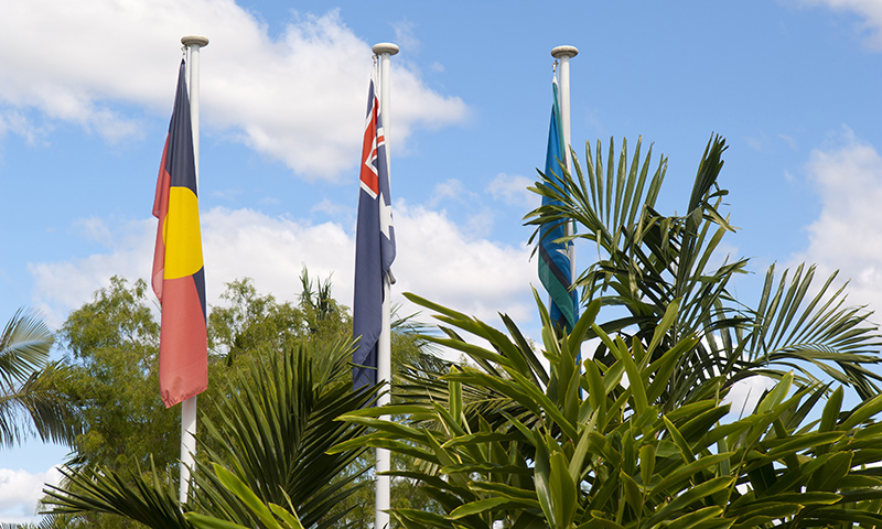 Aboriginal, Australian and Torres Strait Islander flags on flag poles next to each other